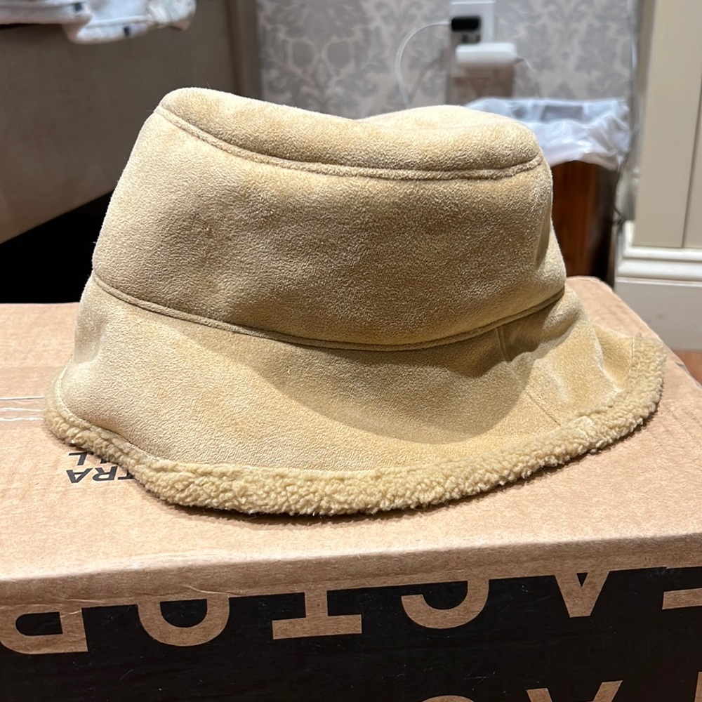 beige/tan fuzzy bucket hat